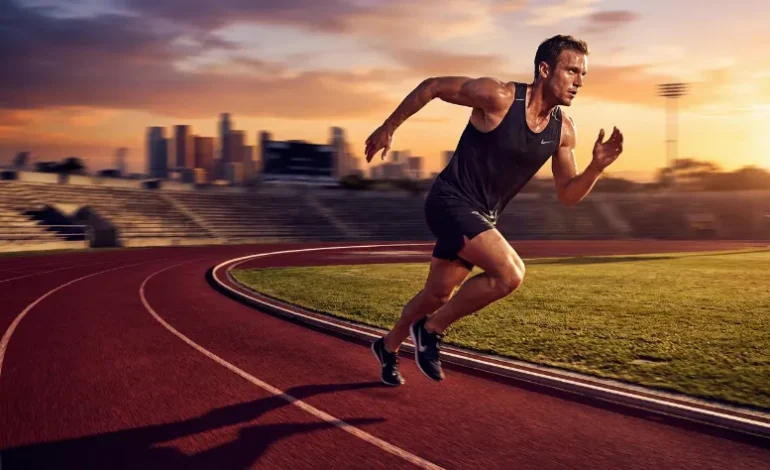 Tekač med intenzivnim tekom na atletski stezi, prikaz Cooperjevega testa.
